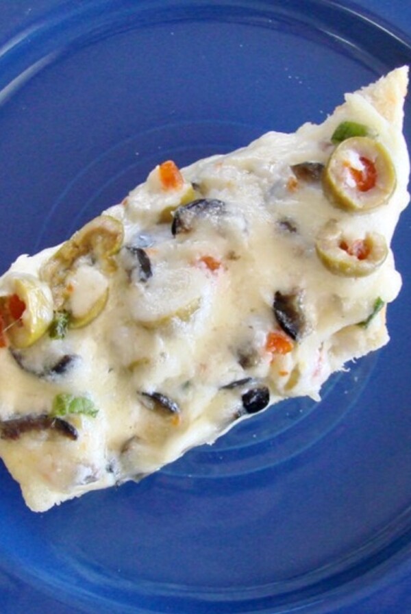 Slice of olive bread on plate.