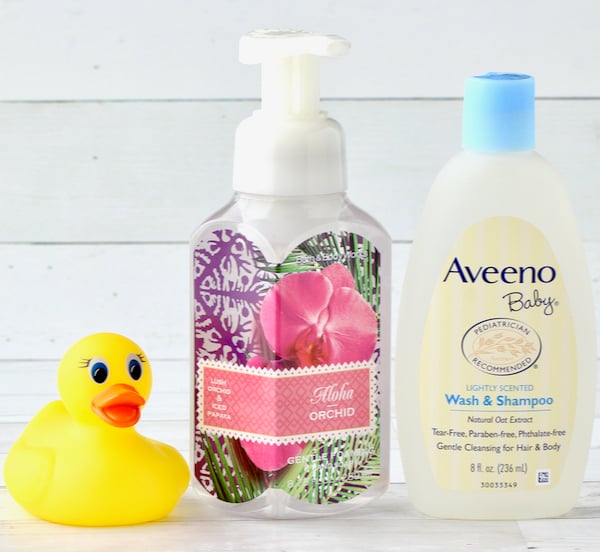 Bottle of baby wash, empty soap container, and rubber ducky.