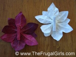Back side of poinsettia hair clips for babies.