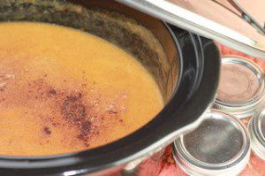 Peach butter set in a slow cooker.
