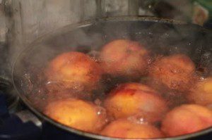 Whole peaches in boiling water.