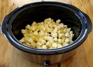 Slow cooker of apple pieces.