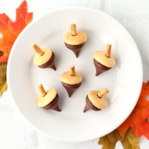Six Hershey Kiss Acorn Cookies on plate.