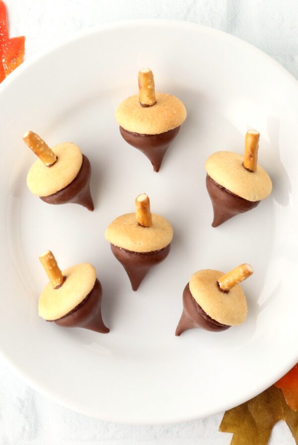 Six Hershey Kiss Acorn Cookies on plate.