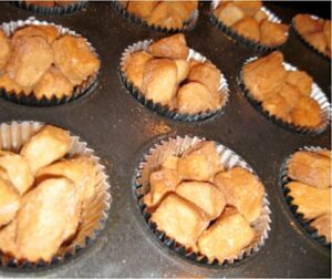 Monkey Bread Muffins in a lined muffin pan.