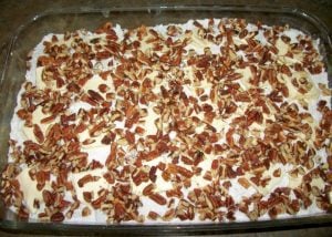 Pecans over butter and cake mix.