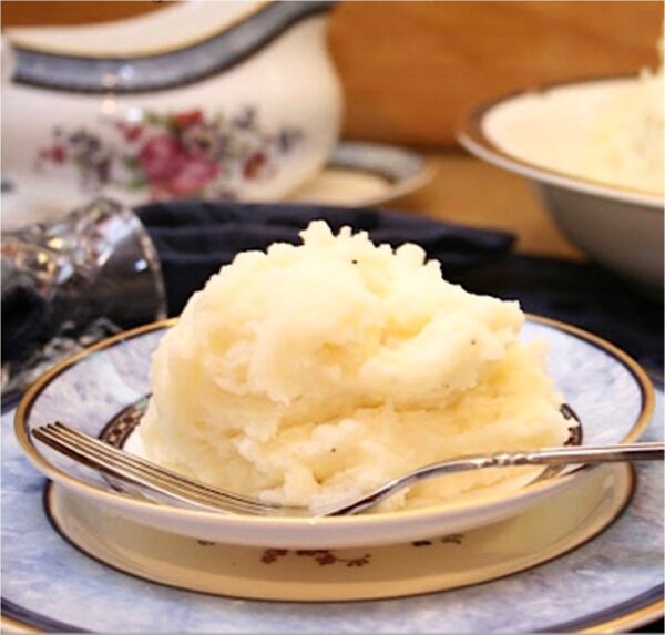 Mashed Potatoes on plate with fork.
