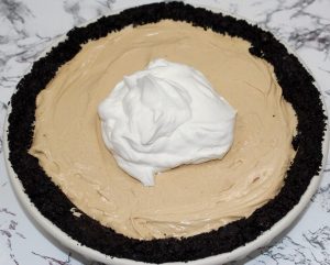 Peanut Butter Dream Pie topped with Cool Whip.