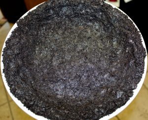 Oreo mixture pressed into a pie dish.