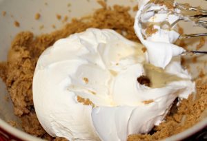 Cool whip with peanut butter in a bowl.