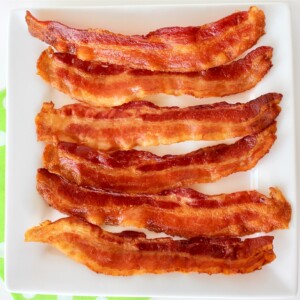 Bacon on a white plate.