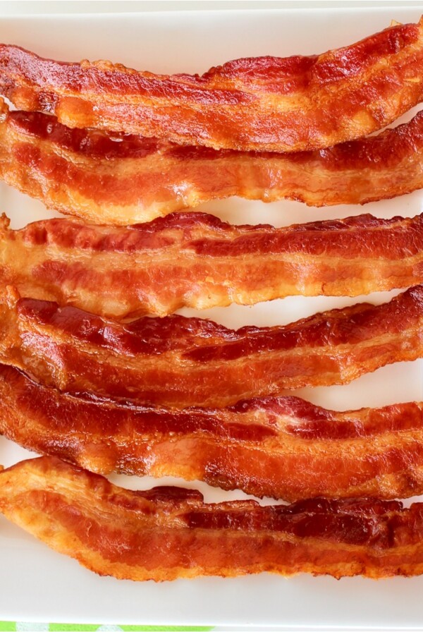 Bacon on a white plate.