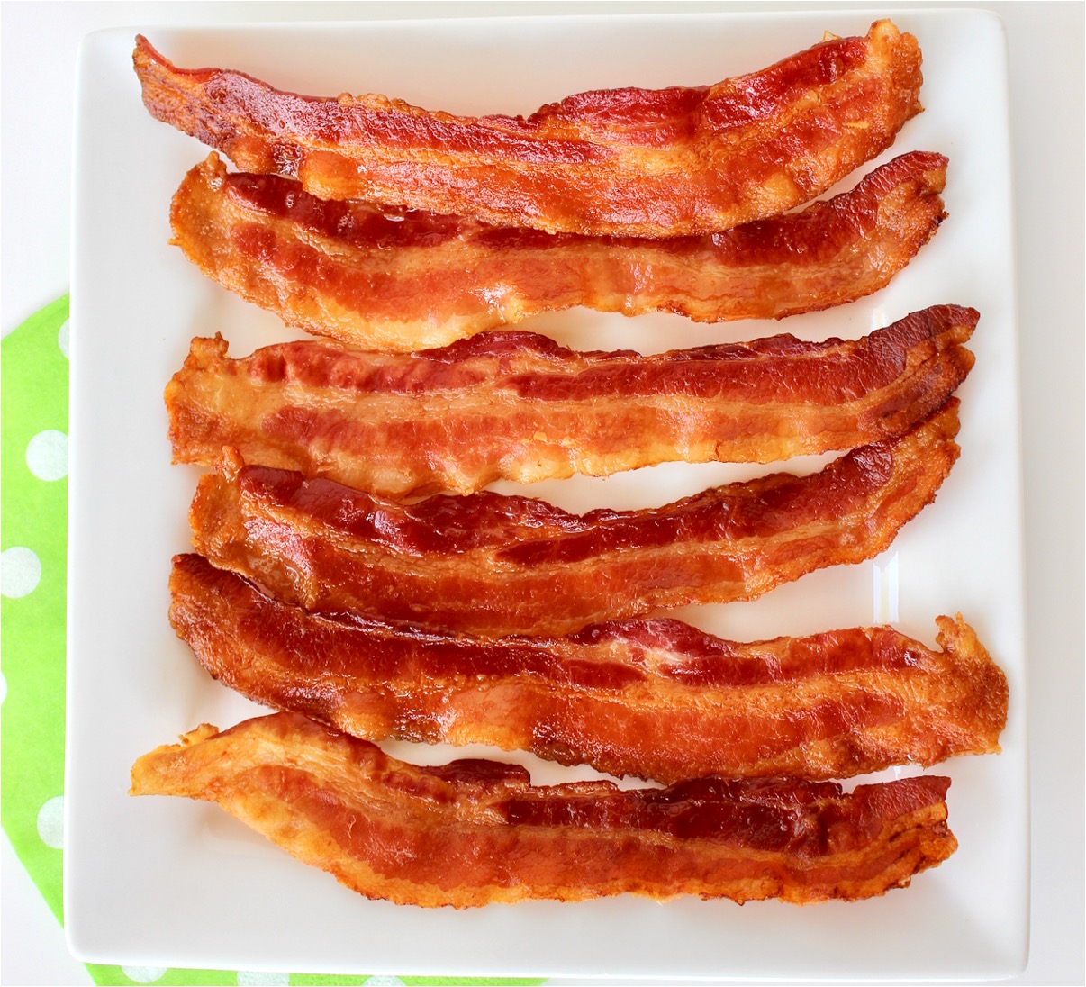 Bacon on a white plate.