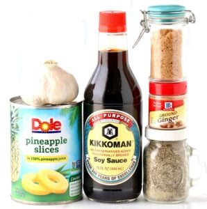 Ingredients including ginger, pineapple slices, and soy sauce.
