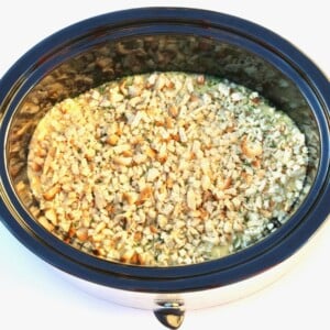 Stuffing over chicken in a slow cooker.