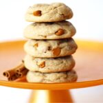 Stack of five soft and chewy spice cookies with cinnamon chips.