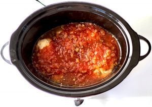 Pineapple Salsa Chicken in a slow cooker.