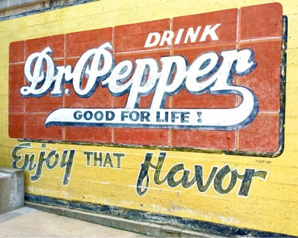 Mural of text: \"Drink Dr. Pepper Good for Life! Enjoy that flavor.\"