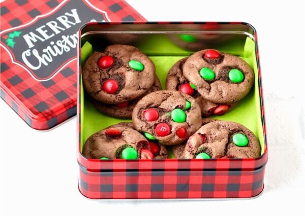 Christmas M&M Cookies in a metal cookie box.
