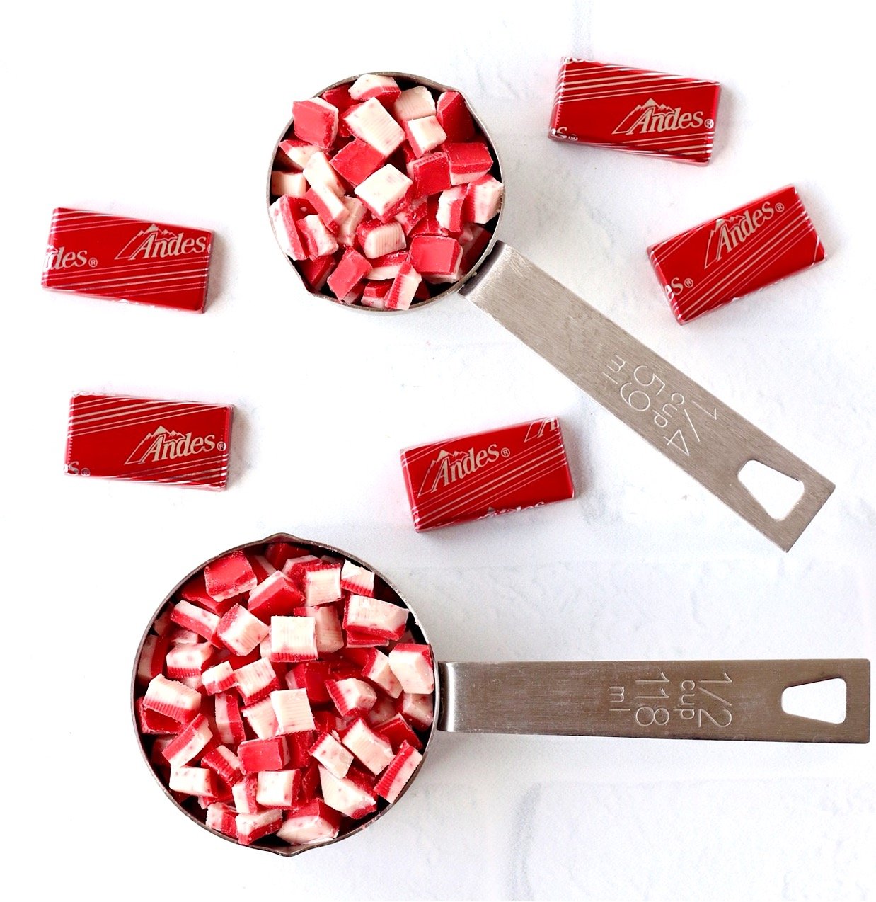 Andes Peppermint Crunch baking chips in measuring cups with Andes Peppermint Crunch thins mints.