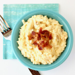 Cheesy bacon hashbrowns in a bowl.