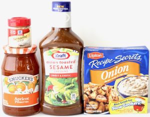Containers of sesame seeds, apricot preserves, sesame dressing, and onion dip mix.