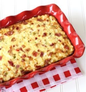 Southwest bacon breakfast casserole in a red baking dish.