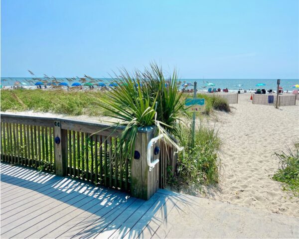 Wooden stairs leading down to a beach.