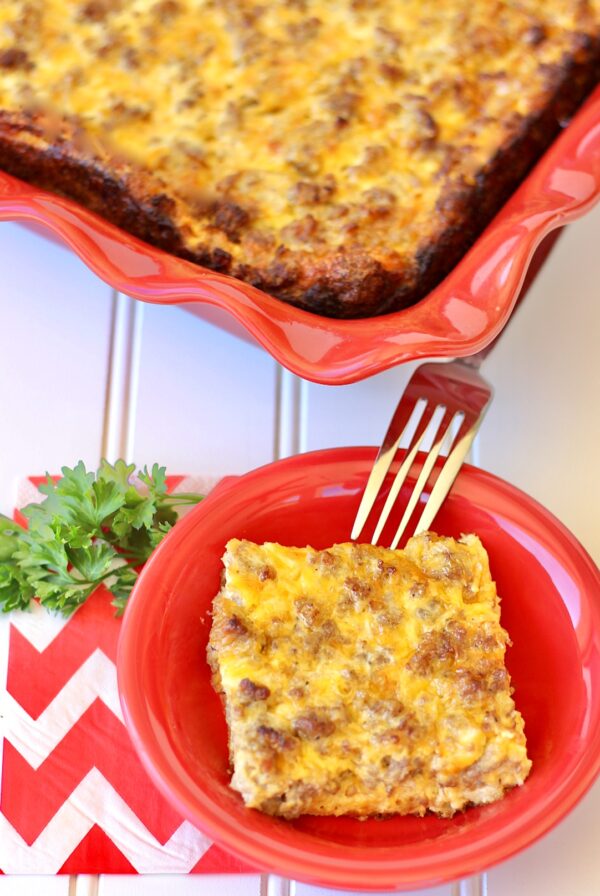 Baked sausage breakfast casserole with eggs and cheese in casserole dish.