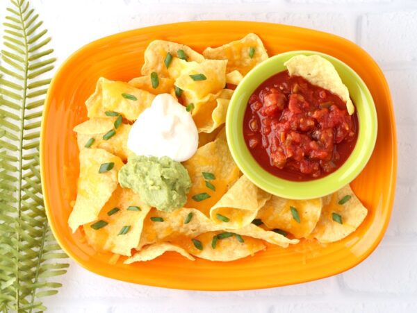 Chips and cheese with salsa, guacamole, and sour cream.