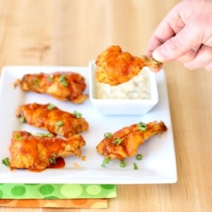 Person holding a buffalo ranch chicken wing.