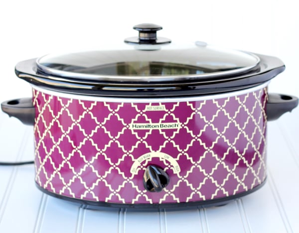 Purple slow cooker with a lid.