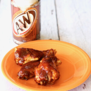 Root Beer Honey BBQ Wings on an orange plate.
