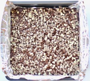 Andes Mint Fudge in a lined baking pan.