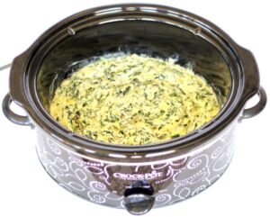 Spinach Artichoke Dip in a slow cooker.