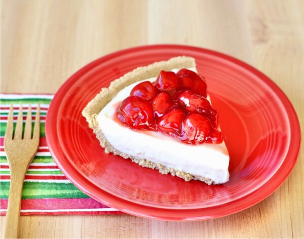 Cherry Cream Cheese Pie on a red plate.