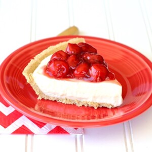 No Bake Cherry Cream Cheese Pie slice on a plate.