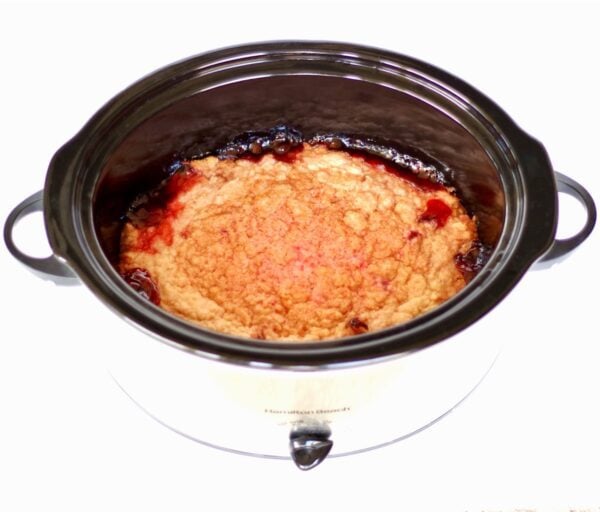 Strawberry Dump Cake in a slow cooker.