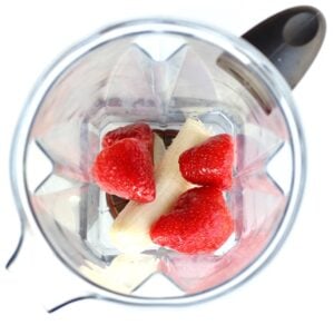 Strawberries and banana in a blender.