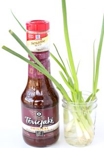 Teriyaki sauce, sesame seeds, and green onions.