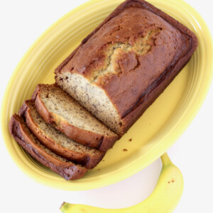 Partially-sliced loaf of banana bread.
