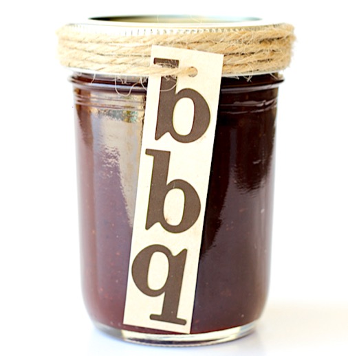 Barbecue sauce in mason jar with bbq tag tied on with twine.