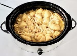 Slow cooker full of Chicken and Dumplings.