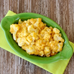 Baked Cheesy Cauliflower in an oblong green bowl.