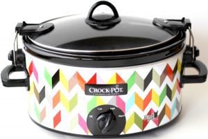 Colorful chevron Crockpot with a lid.
