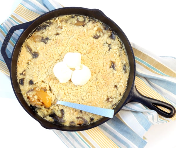 Peach dump cake in cast iron skillet.