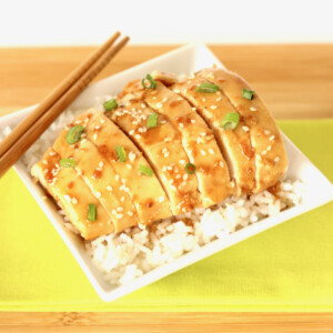 Plate of Honey Sesame Chicken over rice.