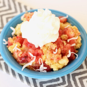 Pineapple Dump Cake in a blue bowl.