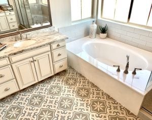 Clean, white bathtub in a bathroom.