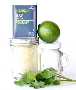 Ingredients including bay leaves, lime, and cilantro.